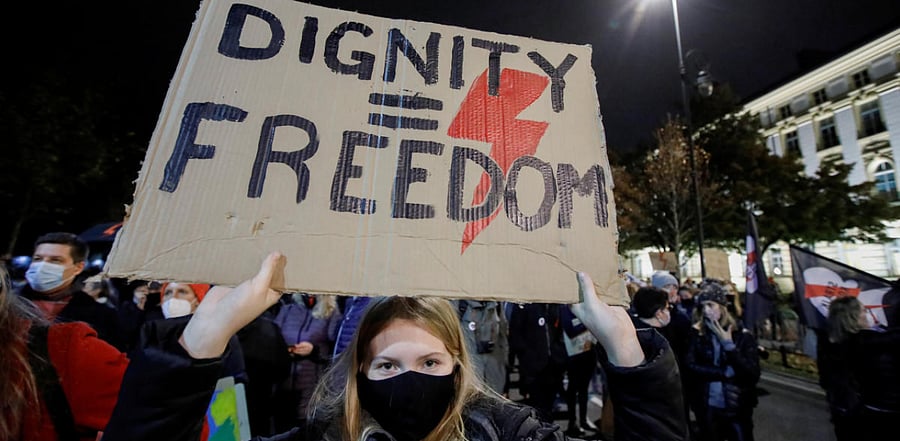 A woman holding a placard takes part in a protest against the ruling by Poland's Constitutional Tribunal that imposes a near-total ban on abortion, in Warsaw, Poland. Credit: Reuters Photo