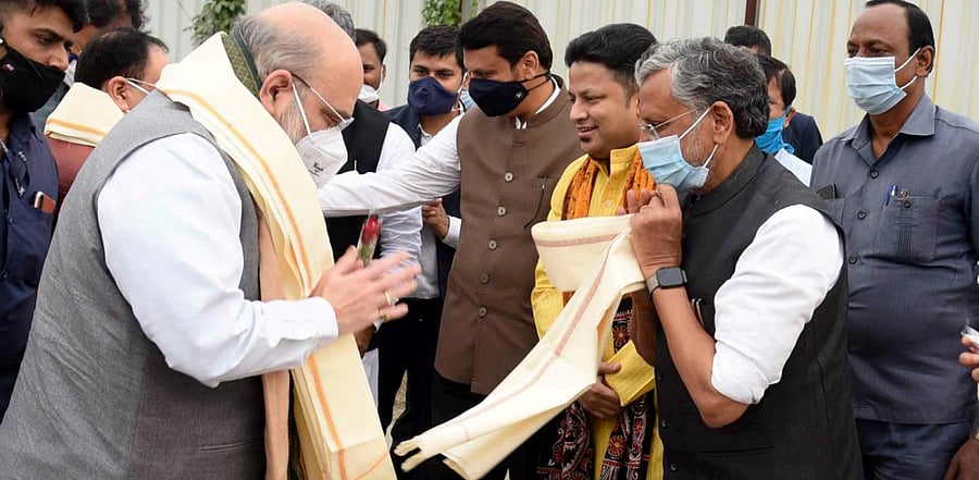 Union Home Minister Amit Shah is welcomed by former Bihar deputy CM Sushil Kumar Modi on his arrival at Jaiprakash Narayan Airport to attend the swearing-in-ceremony of NDA’s government at Raj Bhawan in Patna. Credit: PTI Photo