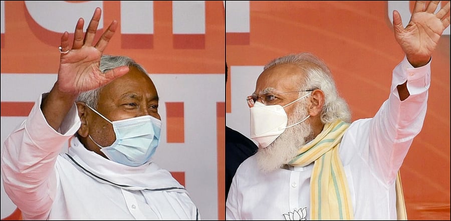 Prime Minister Narendra Modi and Bihar Chief Minister Nitish Kumar wave at the crowd during an election rally for the second phase of Bihar Assembly polls, in Samastipur . Credit: PTI