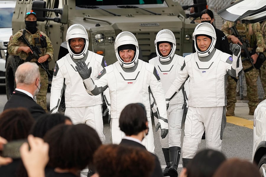   Cape Canaveral:NASA astronauts, from left, Victor Glover, Michael Hopkins, Shannon Walker, and Japan Aerospace Exploration Agency astronaut Soichi Noguchi leave the Operations and Checkout Building on their way to launch pad 39A for the SpaceX Crew-1 mission to the International Space Station at the Kennedy Space Center in Cape Canaveral, Fla., Sunday, Nov. 15, 2020. Credit: AP/PTI Photo