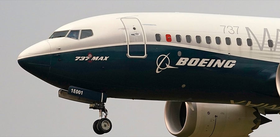 Boeing 737 Max jet, piloted by Federal Aviation Administration Chief Steve Dickson, prepares to land at Boeing Field following a test flight in Seattle. Credit: AP File Photo