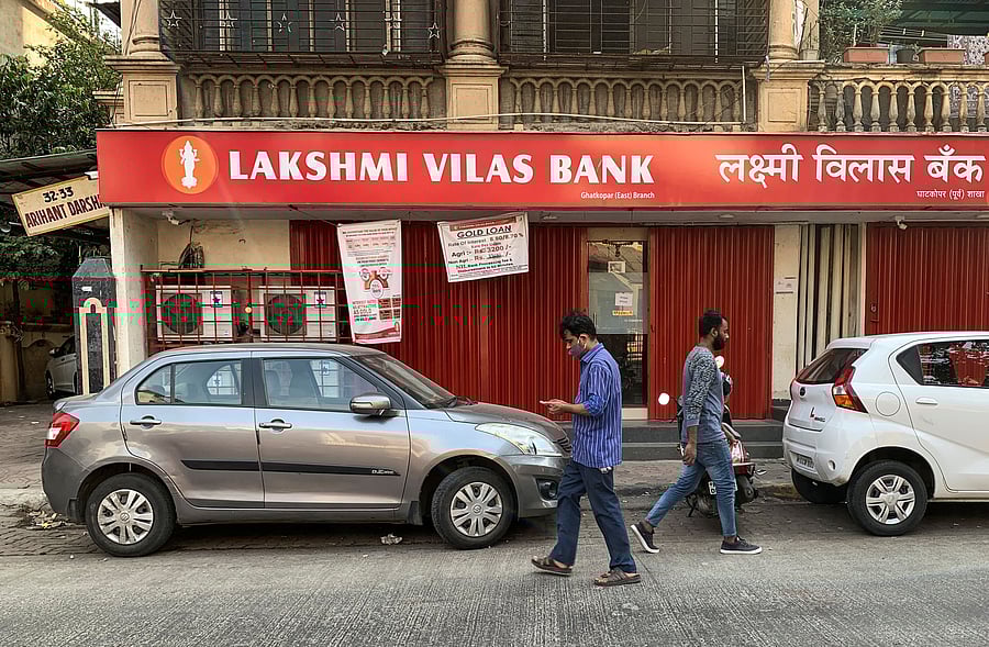 People walk past a Lakshmi Vilas Bank branch in Mumbai, India. Credit: Reuters Photo