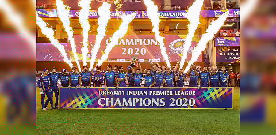 Mumbai Indians team pose with the winners trophy after winning the final cricket match of the Indian Premier League (IPL) T20 against Delhi Capitals, at Dubai International Cricket Stadium in Dubai, Tuesday, Nov. 10, 2020. Credit: PTI