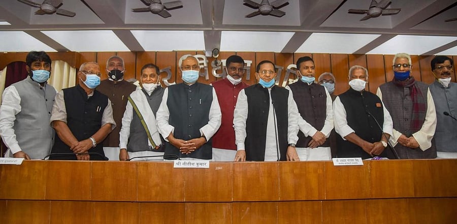 Bihar Chief Minister Nitish Kumar along with Deputy Chief Minister Tarkishore Prasad, Protem Speaker Jitan Ram Manjhi, Chairman of Bihar Legislative Council Awadhesh Narain Singh with newly elected MLCs after oath ceremony at council annex. Credit: PTI.