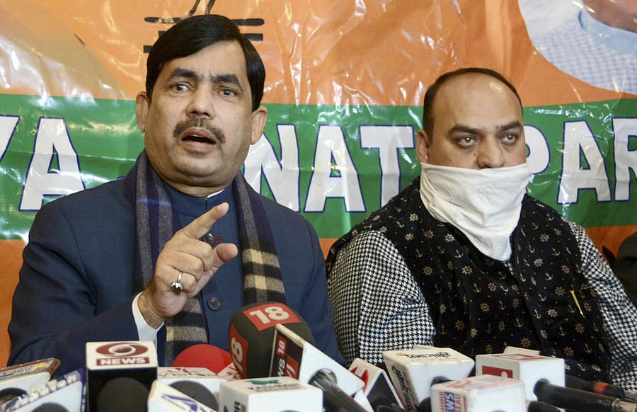 Bharatiya Janata Party (BJP) National spokesperson Shahnawaz Hussain (L). Credit: PTI
