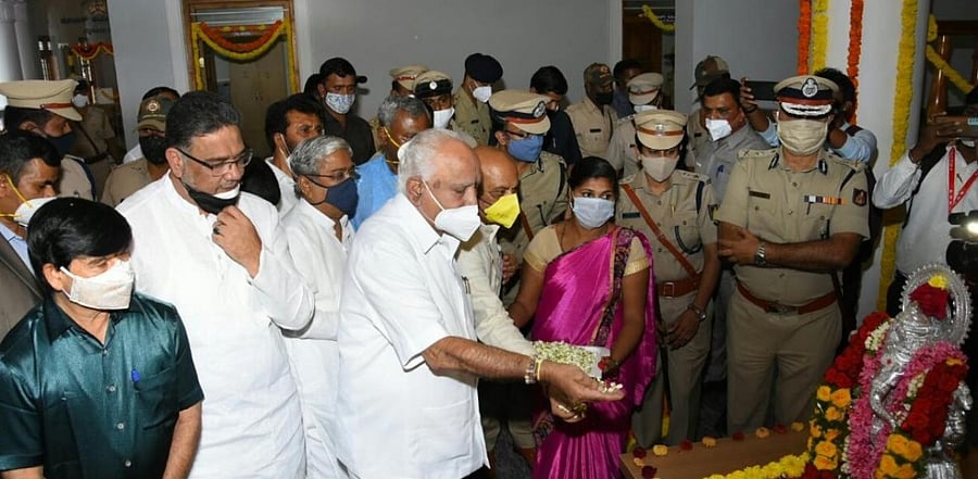 Chief Minister B S Yediyurappa pays floral tributes to an idol of Ganesha, during the inaugural function of the new building of the office of Mysuru Police Commissioner in Mysuru on Tuesday. Credit: DH.
