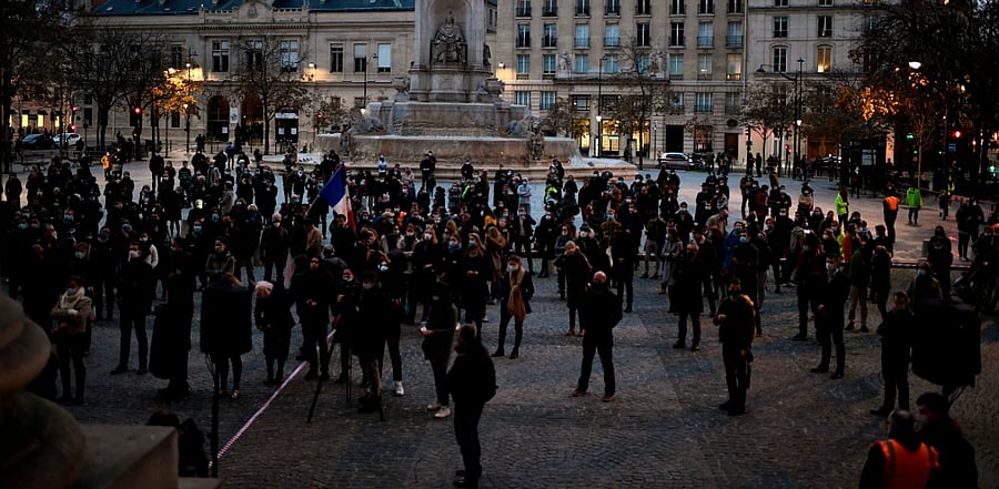 People gather outside the Saint-Sulpice Church to protest against the closure of places of worship during a second lockdown to curb the spread of Covid-19, in Paris on November 22. Credit: AFP Photo