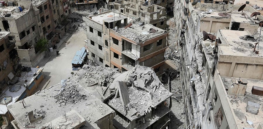 Syrian town of Douma on the outskirts of Damascus is seen after the Syrian army declared that all anti-regime forces have left Eastern Ghouta, following a blistering two month offensive on the rebel enclave. Credit: AFP Photo