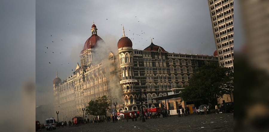 Firefighters attend to a fire as it burns at Taj Mahal Palace & Tower Hotel following an armed siege on November 29, 2008 in Mumbai, India. Credit: Getty Images