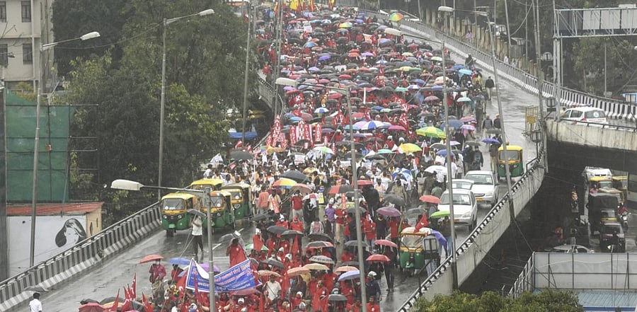 Members of Central Trade Union organisations participate in a protest march against Centre's various economic policies, in Bengaluru. Credit: PTI.