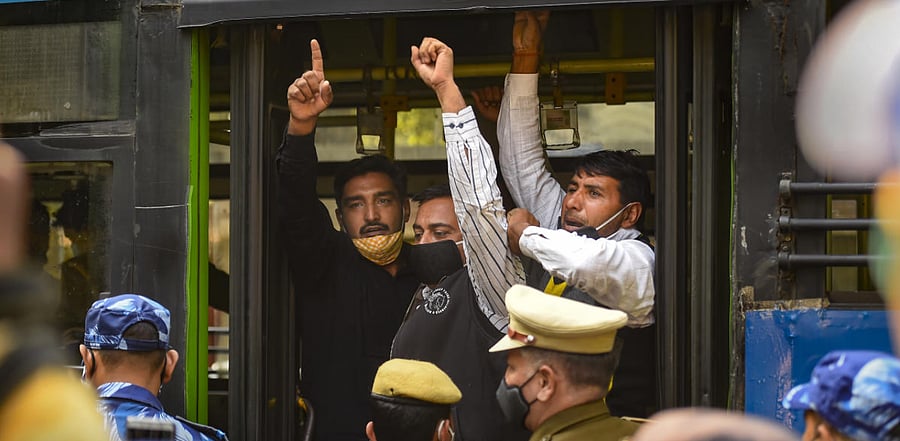 Members of Swaraj India detained by police personnel during a protest against the new farm laws, at Jantar Mantar in New Delhi. Credit: PTI Photo