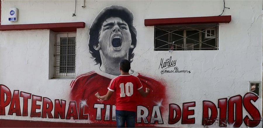 Fans of Argentinian football legend Diego Maradona gather outside Argentinos Junior's Diego Armando Maradona Stadium in La Paternal neighbourhood, Buenos Aires. Credit: AFP