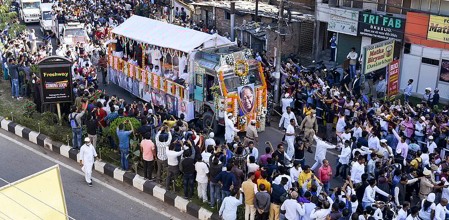 People gather in large numbers to pay their respect to former Assam chief minister Tarun Gogoi as his funeral moves along a road, in Guwahati. Credit: PTI Photo