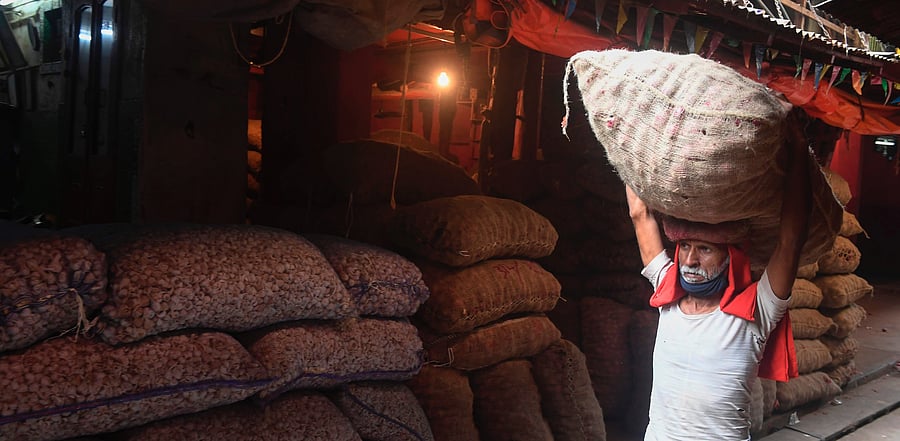 Despite improvement in the growth outlook, however, a recent surge in infections presents downside risks for the economy. Credit: AFP