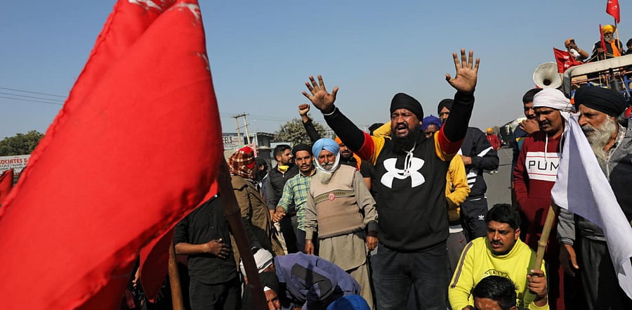 Farmers protest against the newly passed farm bills at Singhu border near Delhi. Credit: Reuters Photo
