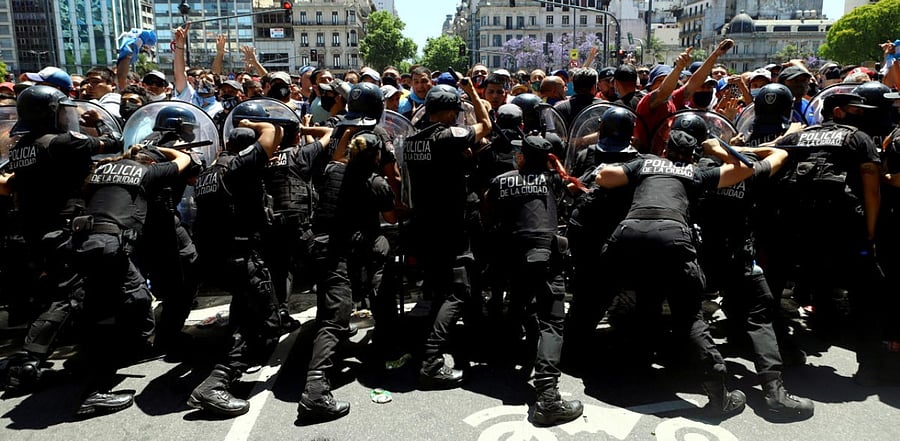 People clash with police during the wake of soccer legend Diego Maradona. Credit: Reuters Photo