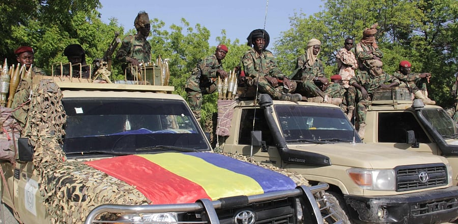 Chadian soldiers belonging to the Joint Task Force gesture while patrolling in Monguno on December 15, 2019. Credit: AFP Photo