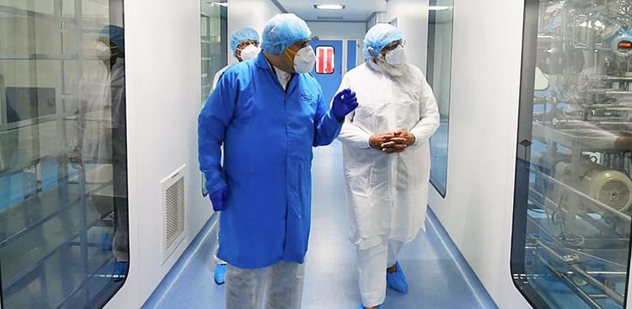 Prime Minister Narendra Modi being briefed during a visit to the Bharat Biotech facility to review the development of indigenous COVID-19 vaccine candidate Covaxin, on the outskirts of Hyderabad, Saturday, Nov. 28, 2020. Credit: PTI Photo