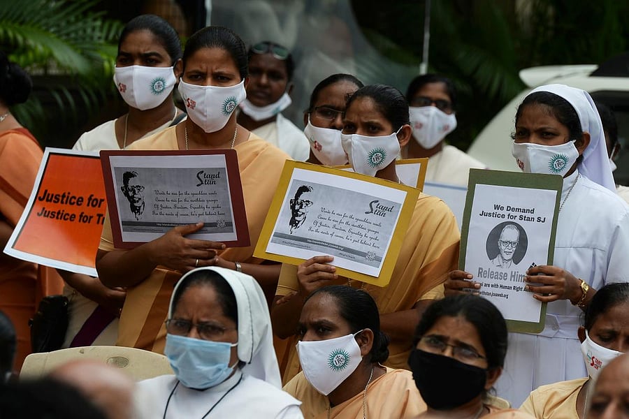 Catholic nuns hold placards during a protest against the arrest of Jesuit priest Father Stan Swamy in Jharkhand. Credit: AFP