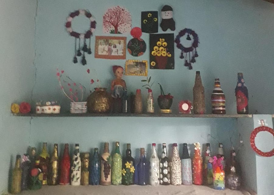 Old bottles and unwanted items have become beautiful artworks in the hands of P J Alina at Gonikoppa.