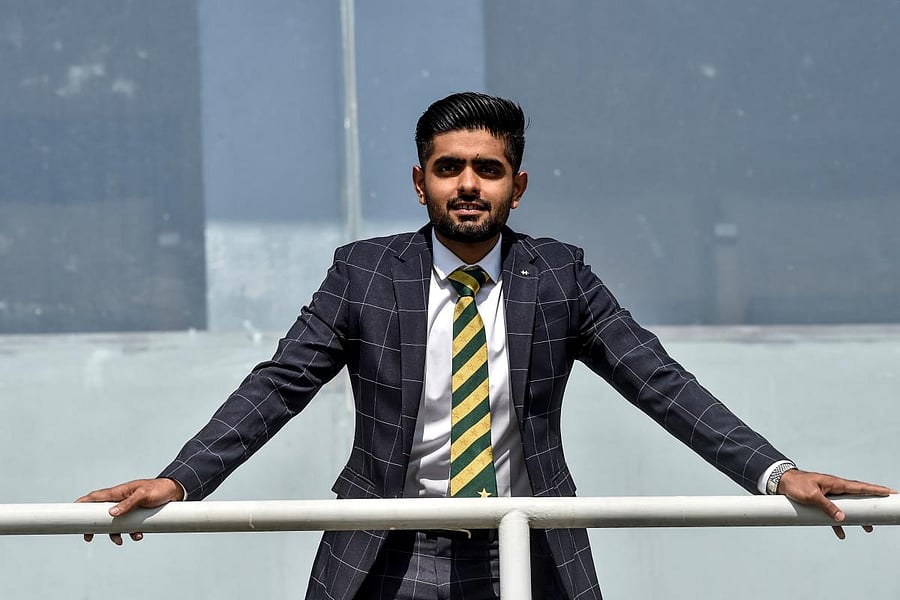 Pakistan's cricket team captain Babar Azam poses for photographs after a media briefing in Lahore. Credit: AFP