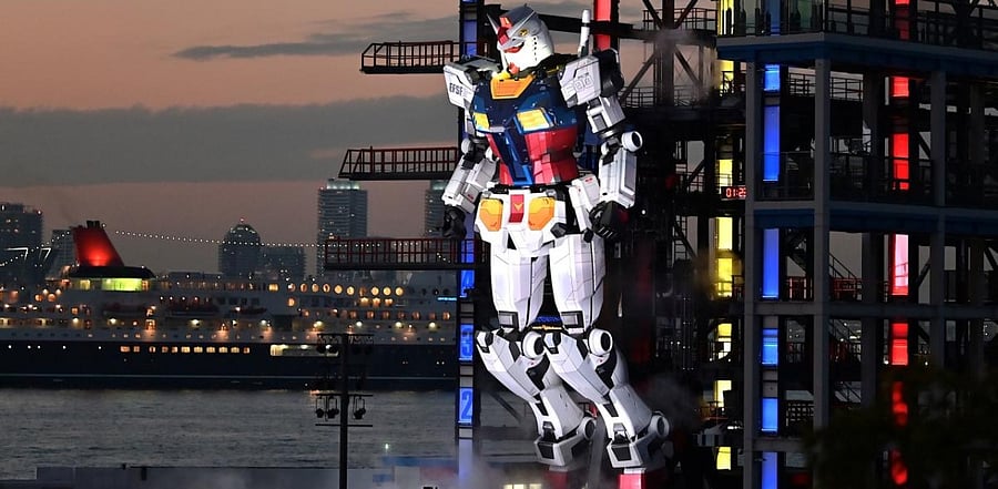A Gundam robot is displayed during sunset at the Gundam factory in Yokohama, Kanagawa prefecture. Credit: AFP Photo