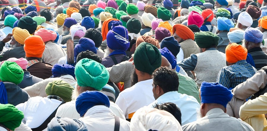 Farmers protest at the Singhu border during their ongoing 'Delhi Chalo' agitation against Centre's new farm laws, in New Delhi. Credit: PTI Photo