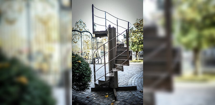 A photograph taken on November 12, 2020 shows a section of the original Eiffel Tower's stairs, displayed in front of the Artcurial auction house in Paris. Credit: AFP Photo