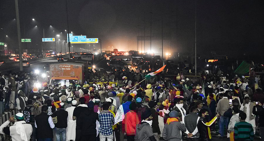 Farmers block a part of the Delhi-Meerut National Highway during their protest march against the new farm laws, in New Delhi. Credit: PTI Photo