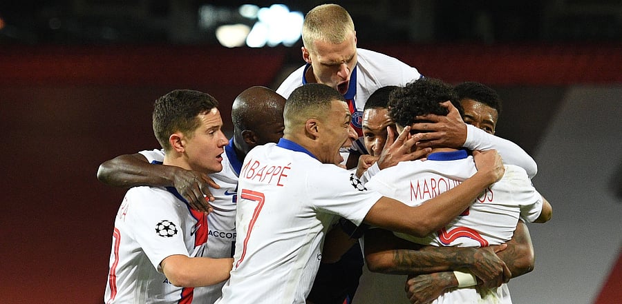 Paris Saint-Germain's Brazilian defender Marquinhos celebrates with teammates after scoring his team's second goal. Credit: AFP Photo