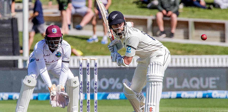 New Zealand's captain Kane Williamson (R) eyes the ball as he bats during the second day of the first Test cricket match between New Zealand and West Indies. Credit: AFP Photo