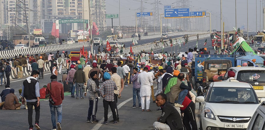Farmers during their ongoing agitation against the Center's new farm laws, at the Delhi-UP border near Ghazipur, in New Delhi. Credit: PTI Photo