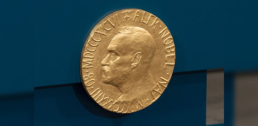 A plaque depicting Alfred Nobel adorns the wall during the Nobel Peace Prize ceremony at Oslo City Town Hall on December 10, 2015 in Oslo, Norway. Credit: Getty Images