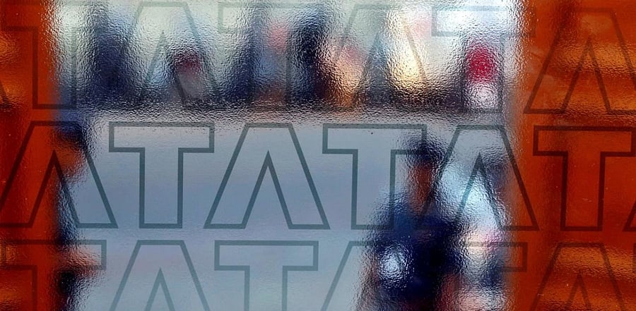 A private security guard stands at the exit gate of the headquarters of Tata Consultancy Services (TCS) in Mumbai. Credit: Reuters Photo