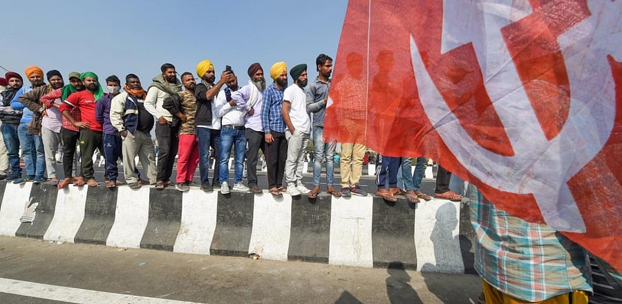 Farmers during their ongoing protest against the Centre's farm reform laws, near the Ghazipur border in New Delhi, Tuesday, Dec. 8, 2020. Various farmer unions called for a nationwide strike today demanding repeal of the Agri laws. Credit: PTI photo.