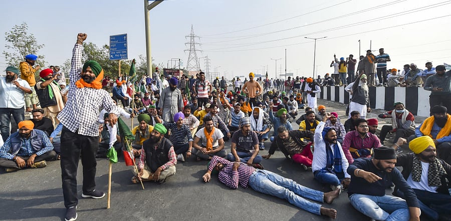 Farmers block the Delhi-Meerut Expressway during their ongoing protest against the Centre's farm reform laws, near Ghazipur border in New Delhi. Credit: PTI Photo