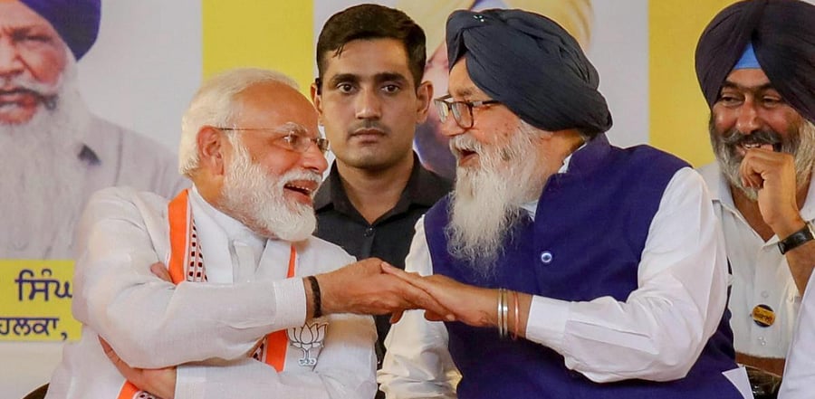 Prime Minister Narendra Modi shares a light moment with Shiromani Akali Dal (SAD) patron and former chief minister of Punjab Parkash Singh Badal. Credit: PTI Photo