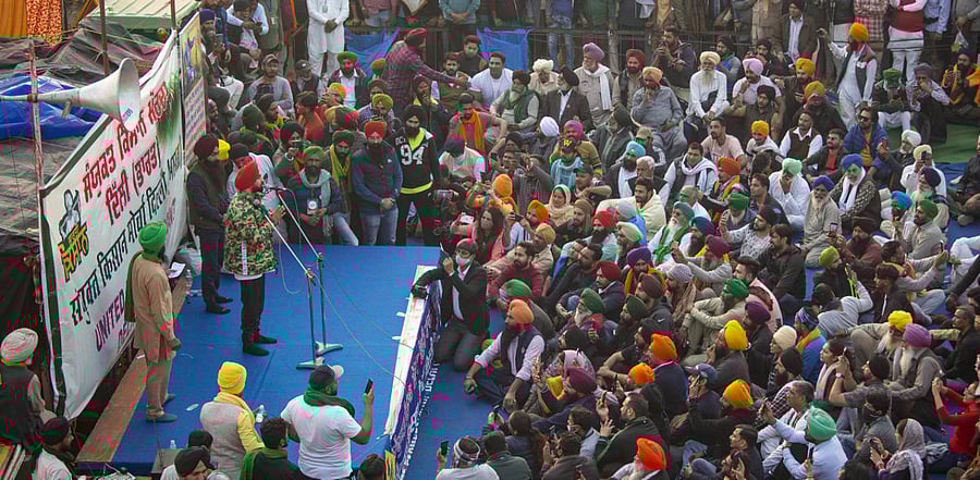 Punjabi actor and singer Diljit Dosanjh addresses during farmers' 'Delhi Chalo' protest against the Centre's new farm laws, at the Singhu border in New Delhi. Credit: PTi Photo