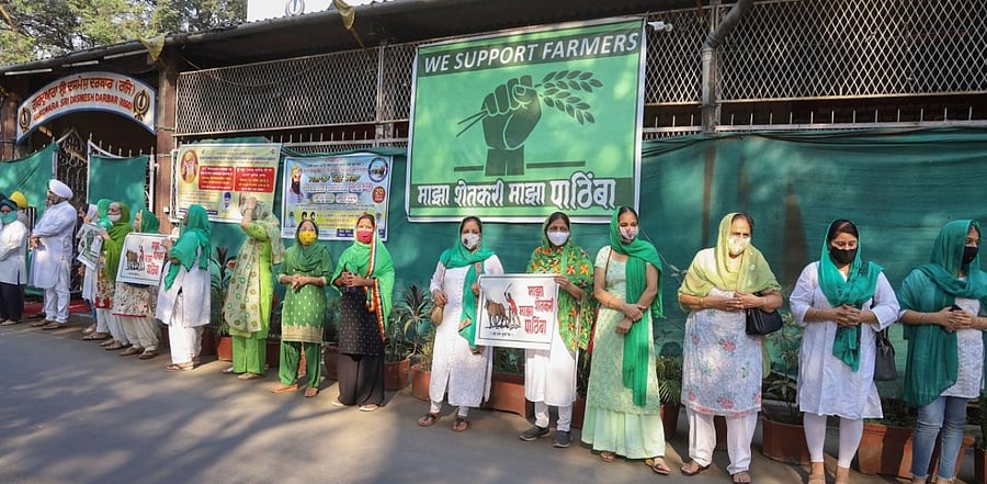 People belonging to Sikh community participate in a rally during the nationwide strike, called by agitating farmers to press for repeal of the Centre's agri laws, in Thane. Credit: PTI photo.