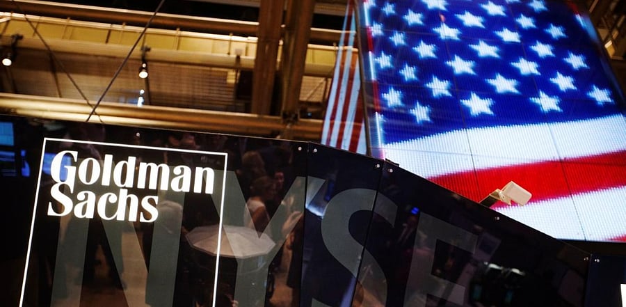 The Goldman Sachs logo is displayed on a post above the floor of the New York Stock Exchange. Credit: Reuters Photo