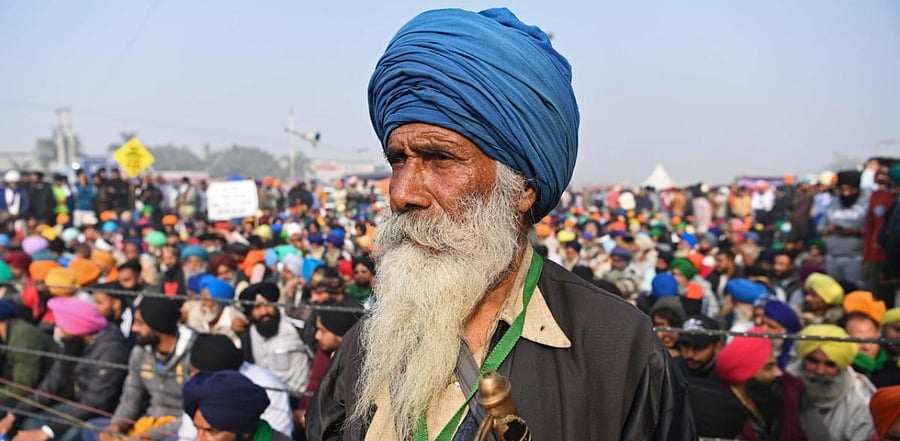 Farmers take part in a nationwide general strike to protest against the recent agricultural reforms at the Delhi-Haryana state border in Singhu. Credit: AFP Photo