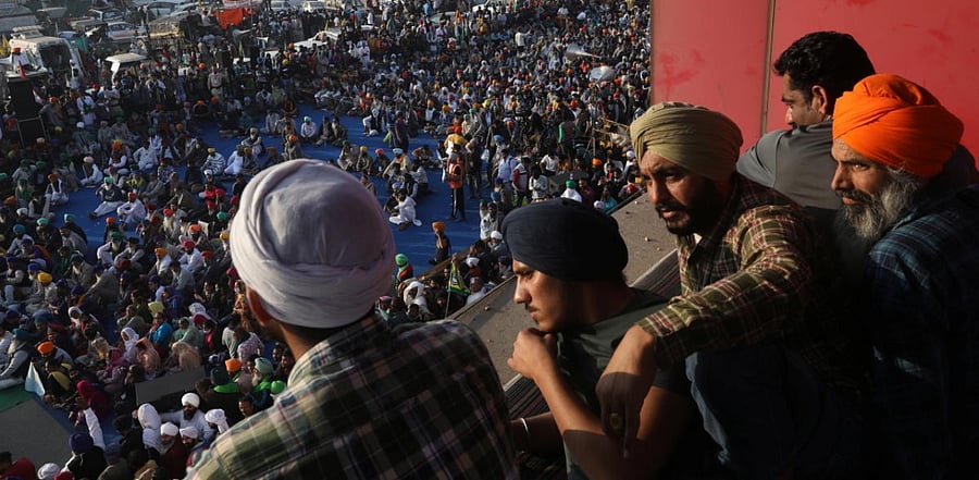 Farmers attend a protest during a nationwide strike against the newly passed farm bills at Singhu border near Delhi. Credit: Reuters Photo