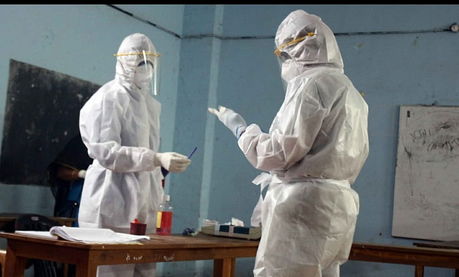 Those tested Covid-19 positive after Monday afternoon and those in quarantine were allowed to vote by wearing PPE kit during the local body polls in Kerala on Tuesday. A scene from Thiruvananthapuram. Credit: Pics by arrangement.