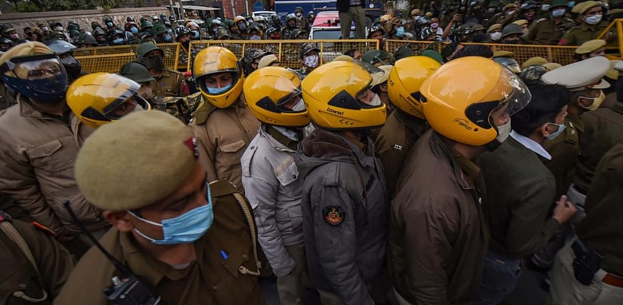 Security personnel stand outside the residence of Delhi CM and AAP leader Arvind Kejriwal. Credit: PTI photo.
