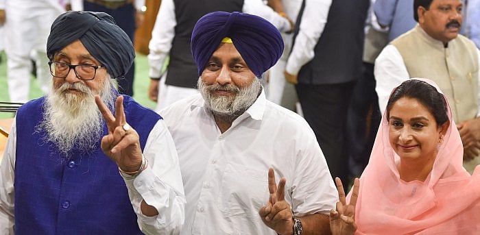 Shiromani Akali Dal leader Parkash Singh Badal (L), Sukhbir Singh Badal and his wife Harsimrat Kaur Badal (R) during the NDA parliamentary board meeting at Parliament House, in New Delhi. Credit: PTI