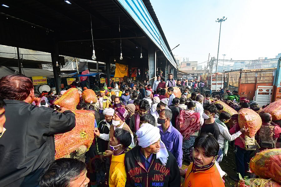 Crowd at Azadpur vegetable market amid a nationwide strike called by agitating farmer to press for repeal of the Centre''s agri laws. Credit: PTI Photo