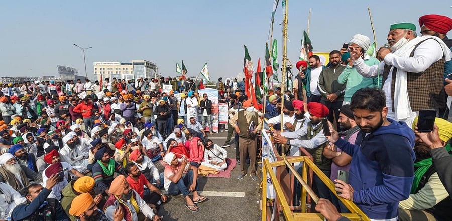 Bharatiya Kisan Union (BKU) spokesperson along with farmers protests against the Centre's farm reform laws near Ghazipur border, in New Delhi. Credit: PTI Photo