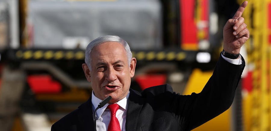 Israeli Prime minister Benjamin Netanyahu attends the arrival of a DHL plane carrying a first batch of Pfizer/BioNTech COVID-19 vaccine, following the outbreak of the coronavirus disease (COVID-19), at Ben Gurion Airport near Tel Aviv, Israel December 9, 2020. Credit: Reuters Photo