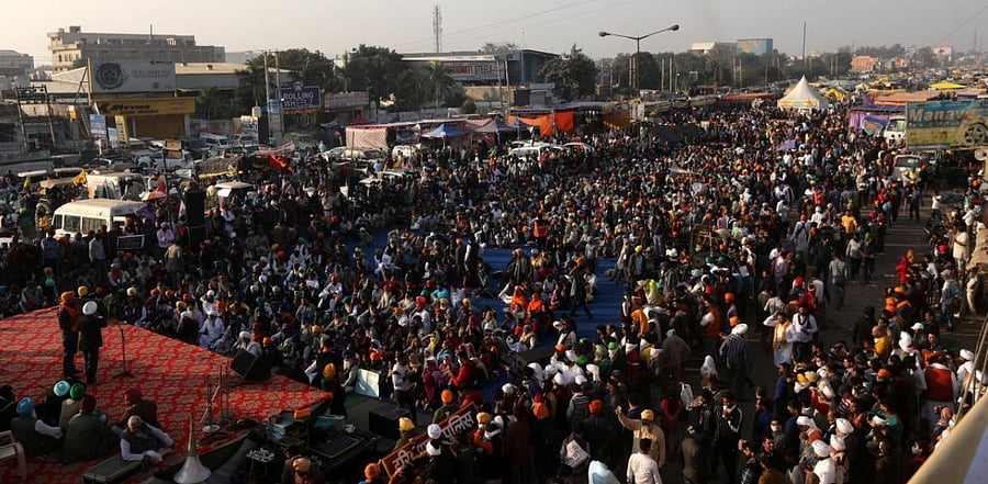 Farmers attend a protest during a nationwide strike against the newly passed farm bills at Singhu border near Delhi. Credit: Reuters Photo