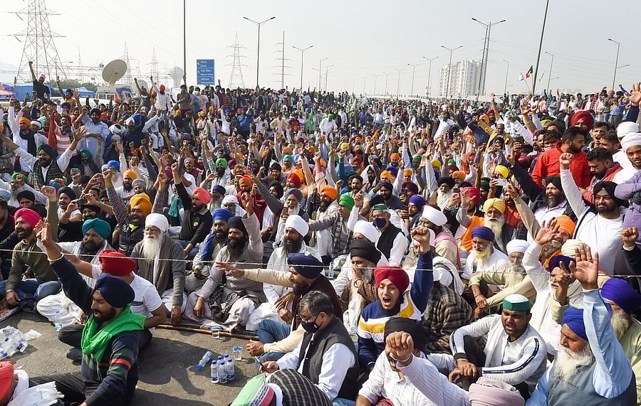 Farmers during their ongoing protest against the Centre's farm reform laws, near the Ghazipur border in New Delhi, Tuesday, Dec. 8, 2020. Various farmer unions today called for a nationwide strike demanding repeal of the agri laws. Credit: PTI Photo